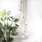 Large lighting cluster featuring 5 pendants featuring antique style bulbs