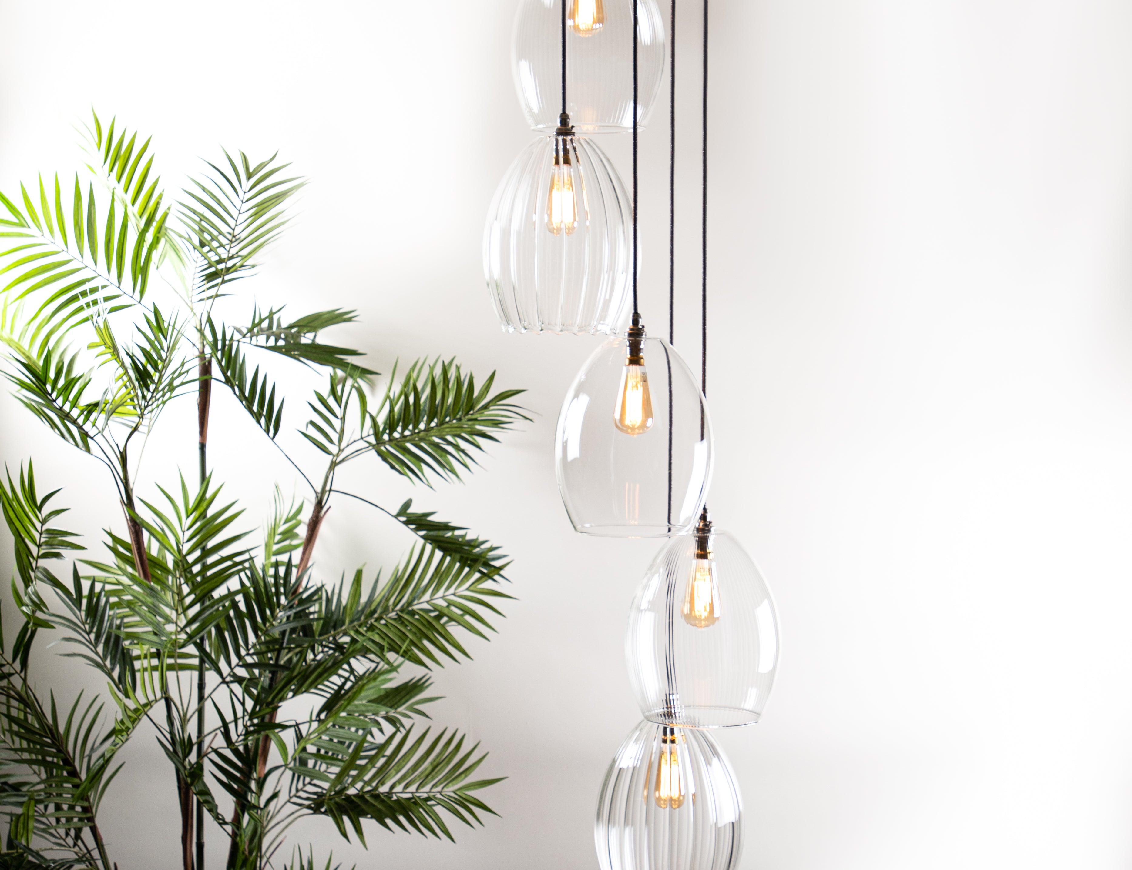 Large lighting cluster featuring 5 pendants featuring antique style bulbs