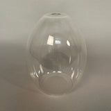 Clear glass pendant light on a grey background