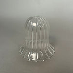 Clear glass decorative light on a gray background