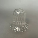 Clear glass decorative light on a gray background