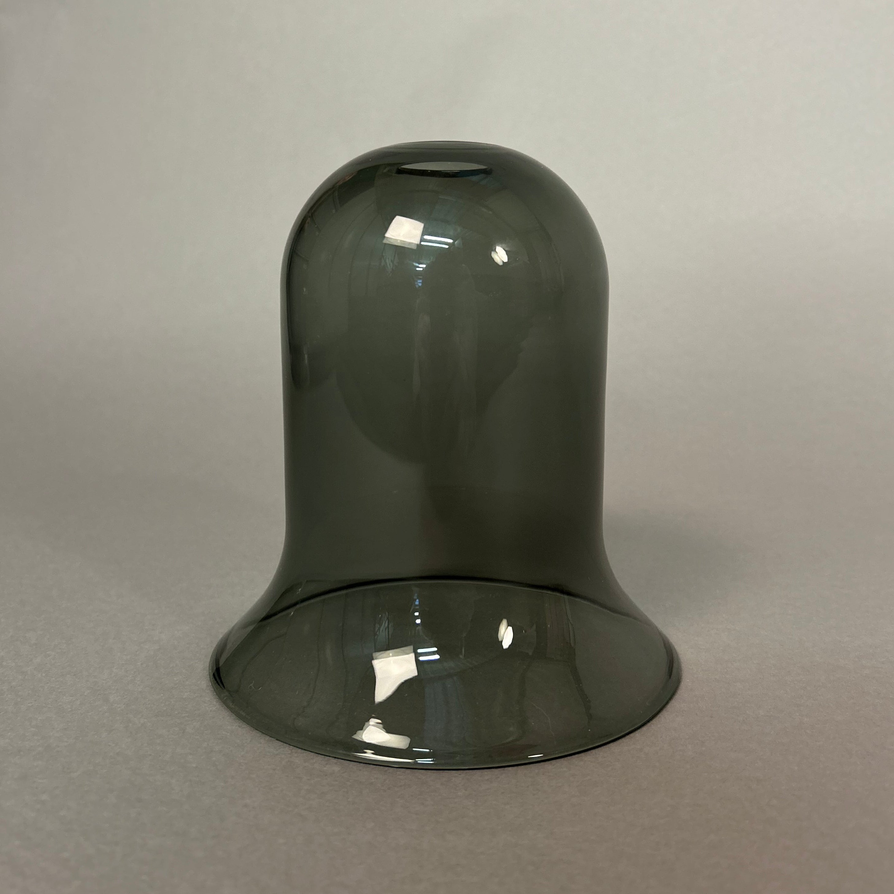 Dark grey glass light on a light grey background