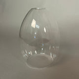 Clear glass pendant light on a light grey background