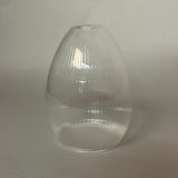 Clear ribbed glass pendant light on a light gray background