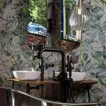 Modern bathroom featuring copper roll top bath tub and large ribbed glass pendant light